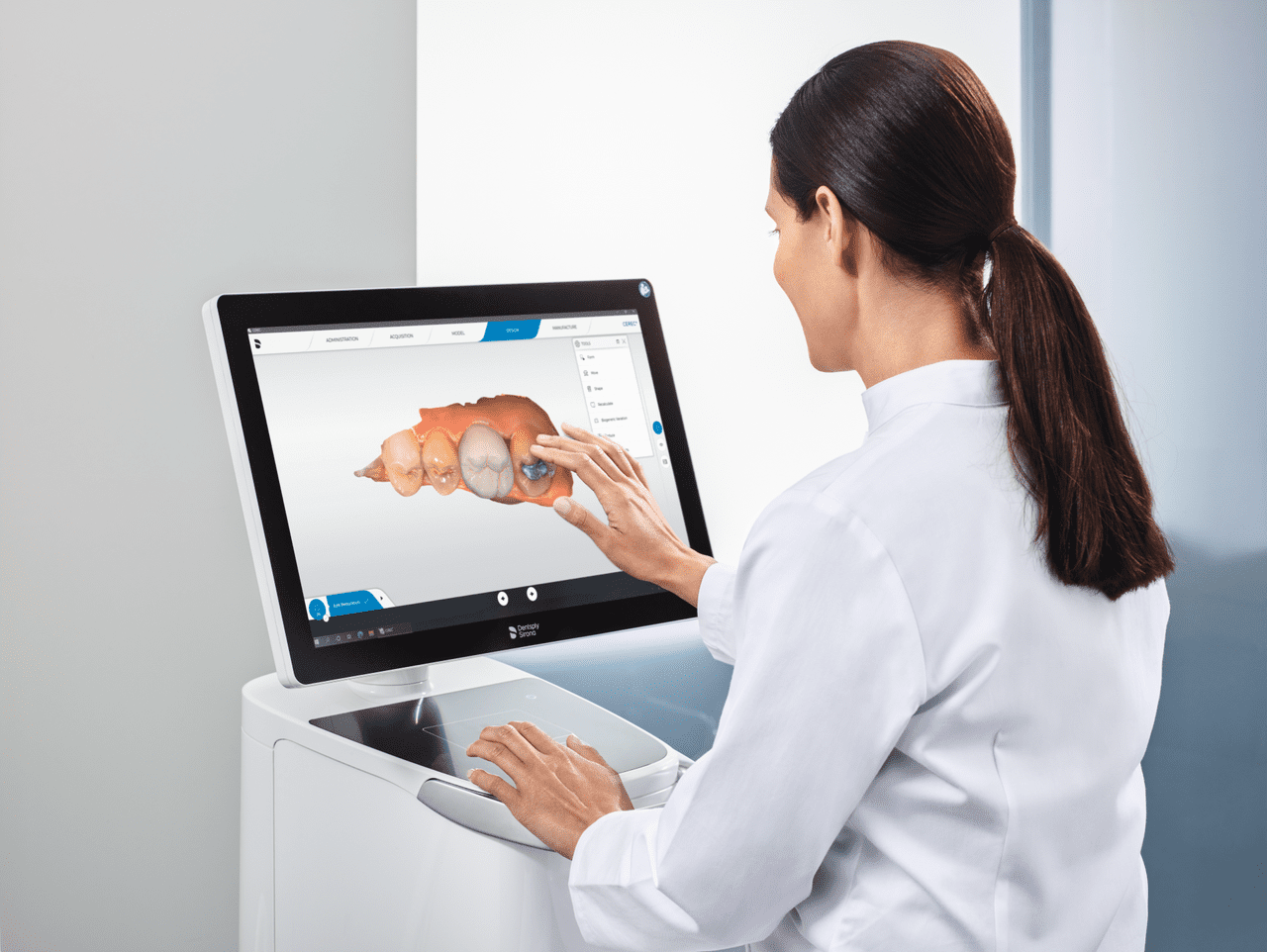 Female dentist using CEREC Primescan AC